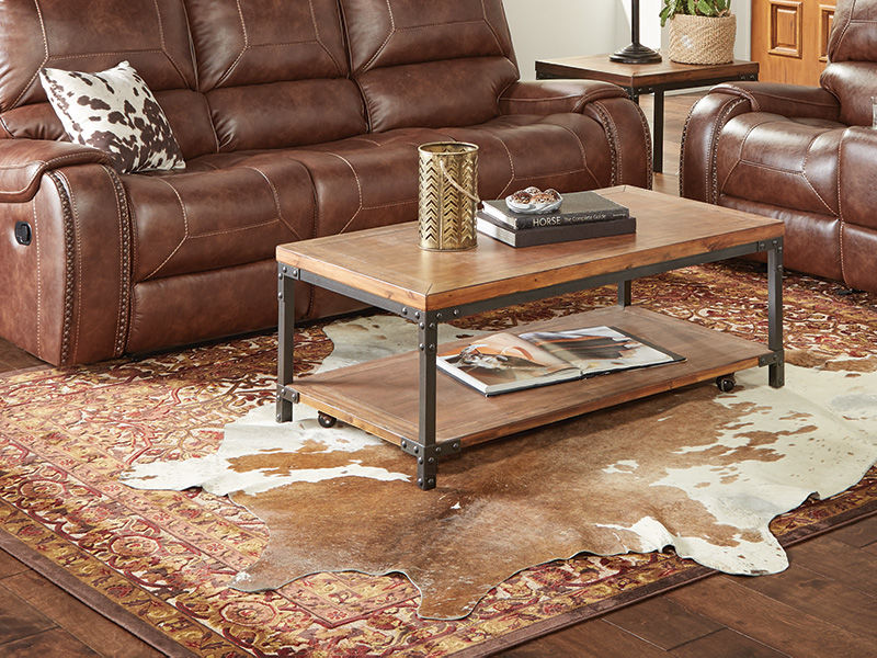 Image of a brown and white cowhide rug in a living room